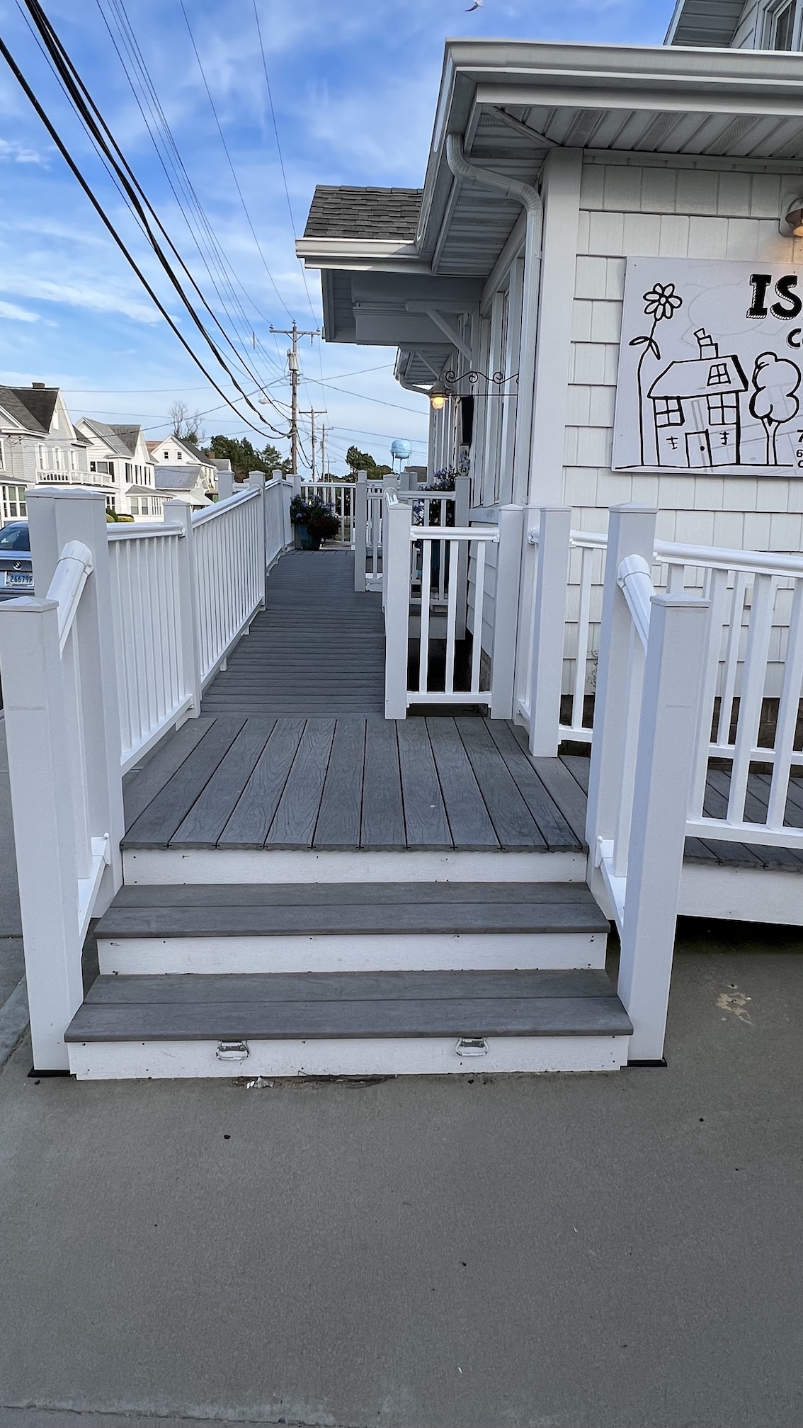 The steps and front porch of the Island Community House.